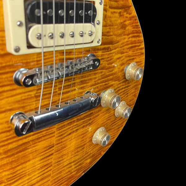 Vintage V100AFD Reissued Electric Guitar in Flamed Amber