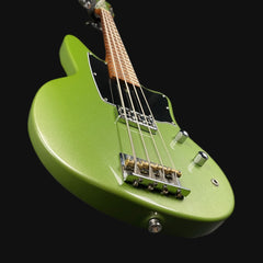 Green electric guitar on a black background