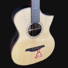 Acoustic guitar with a visible brand logo on a black background