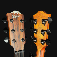 Close-up of two wooden guitar heads with tuning pegs on a black background