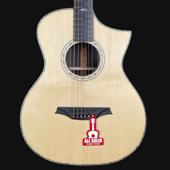 Acoustic guitar with a visible brand logo on a black background