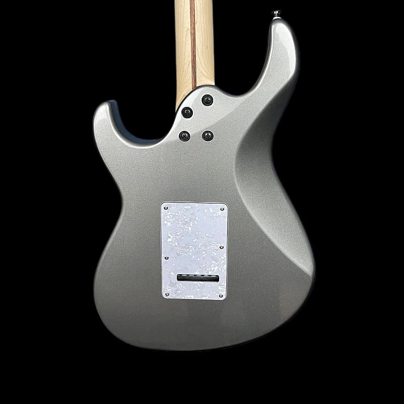 Silver electric guitar on a black background