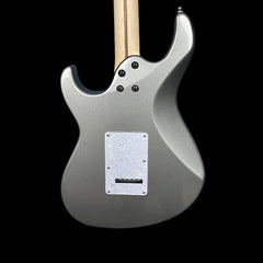 Silver electric guitar on a black background