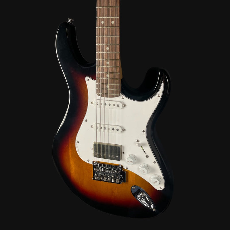 Electric guitar with sunburst finish on a black background