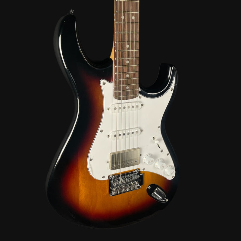 Electric guitar with a sunburst finish on a black background