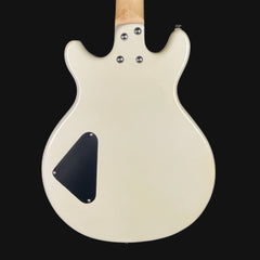 Back view of a white electric guitar with a black pickguard on a black background