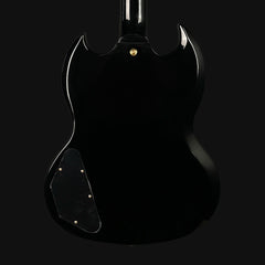Black electric guitar on a black background
