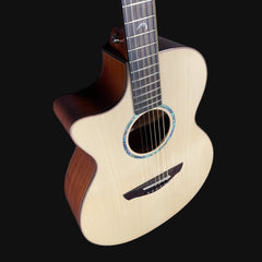 Acoustic guitar with a wooden body and dark brown neck on a black background