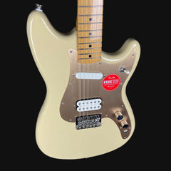 Beige electric guitar with a red Fender label on a black background