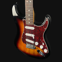 Electric guitar with a sunburst finish on a black background