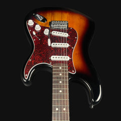 Electric guitar with a sunburst finish on a black background