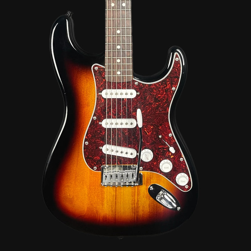 Electric guitar with a sunburst finish on a black background