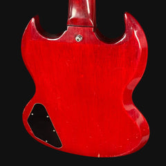 Red guitar body on a black background