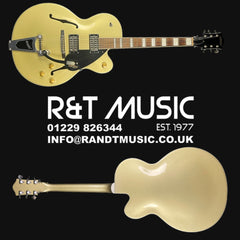 Gold electric guitar with R&T Music branding on a black background