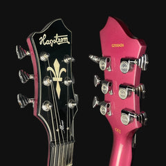 Close-up of Hagstrom guitar heads with brand logo on a black background