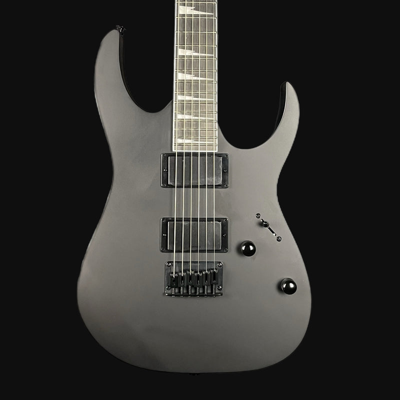 Gray electric guitar on a black background