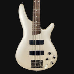 White bass guitar with a black pickguard on a white background