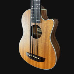 Wooden ukulele with a dark brown finish on a black background