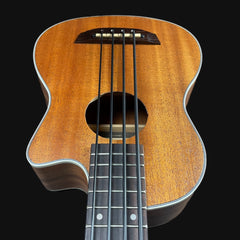 Wooden ukulele with a dark brown finish on a black background