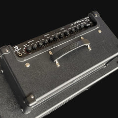 Guitar amplifier with control panel on a black background