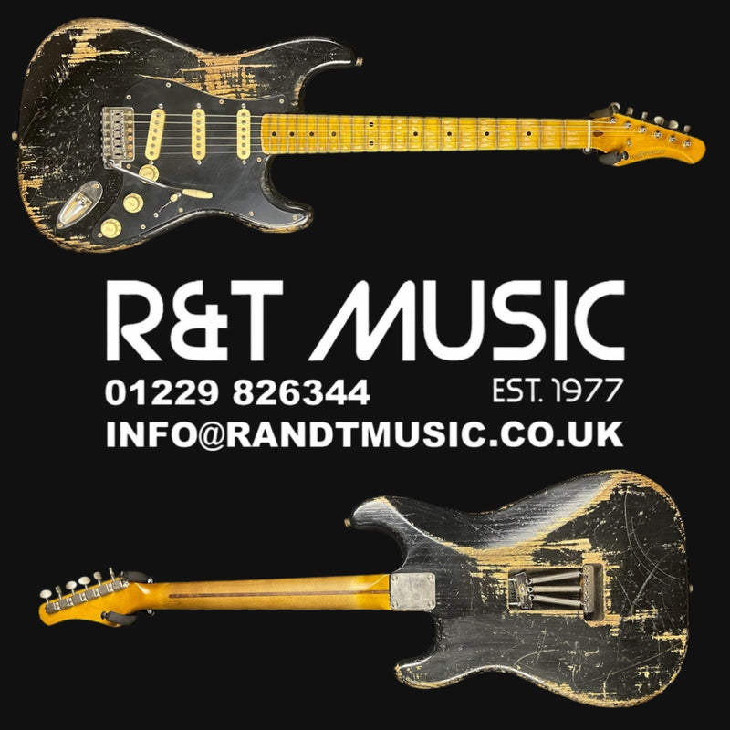 Vintage electric guitar with R&T Music branding on a black background