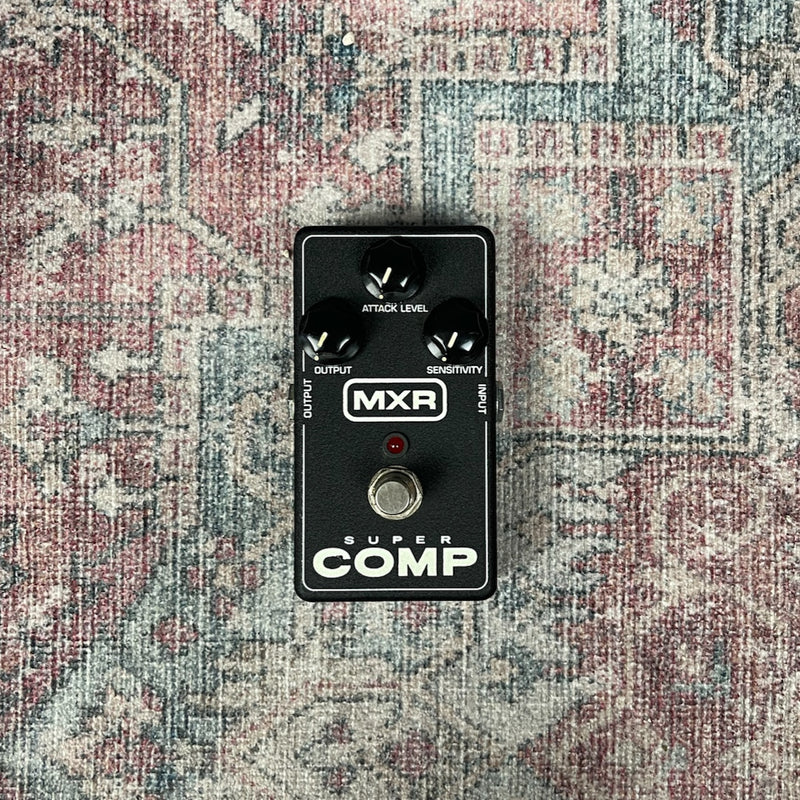 MXR Super Comp guitar effects pedal on a textured surface