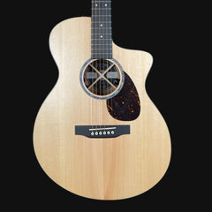 Acoustic guitar with a natural wood finish on a black background