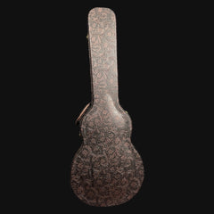 Decorative guitar case with intricate patterns on a black background