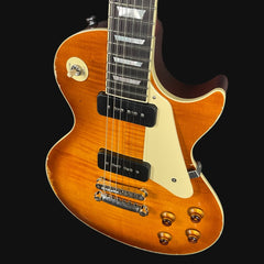 Electric guitar with a sunburst finish on a black background