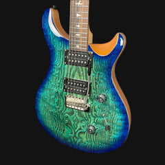 Blue electric guitar with a wavy pattern on a black background