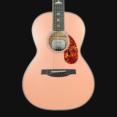 Acoustic guitar with a sunburst finish on a black background