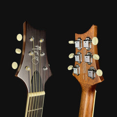 Close-up of two guitar heads with brand logos on a black background