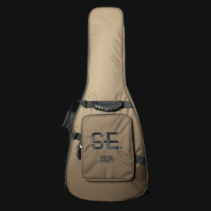 Brown guitar case with 'SE' logo on a black background