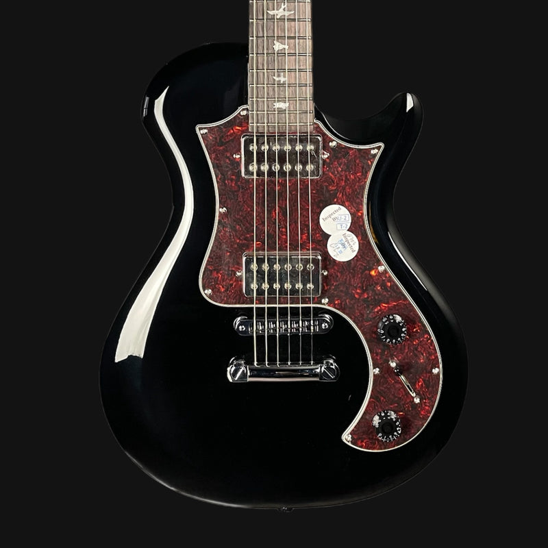 Black electric guitar with red flame pattern on a black background