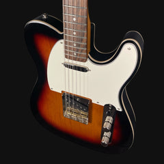 Electric guitar with a sunburst finish on a black background