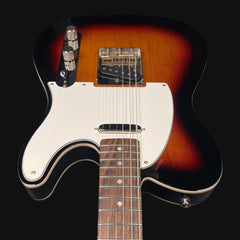 Electric guitar with sunburst finish on a black background
