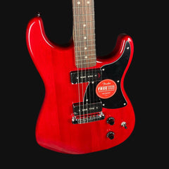 Red electric guitar with a Fender logo on a black background