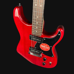 Red electric guitar with a Fender logo on a black background
