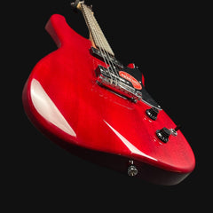 Red electric guitar on a black background