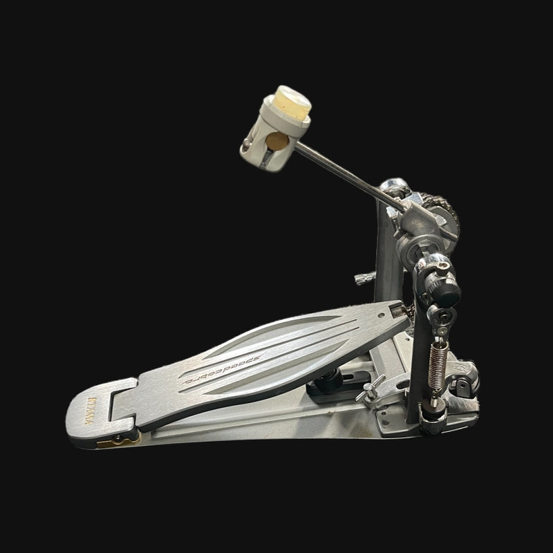 Metallic drum pedal on a black background