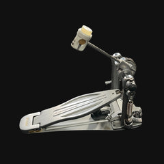 Metallic drum pedal on a black background