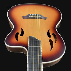Acoustic guitar with a sunburst finish on a black background