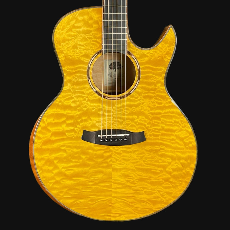 Yellow acoustic guitar with a black pickguard on a black background