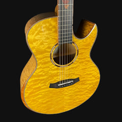 Yellow acoustic guitar with a black pickguard on a black background