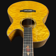Acoustic guitar with a yellowburst finish on a black background