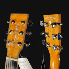 Two guitar heads with 'Carved' branding on a black background
