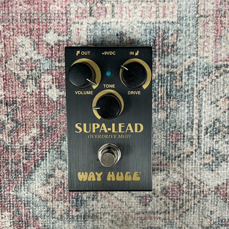 Guitar effects pedal labeled 'Supa-Lead' on a textured surface