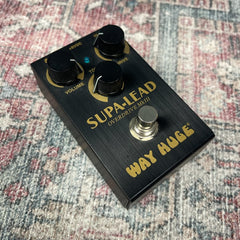 Way Huge Supa-Lead Overdrive guitar effects pedal on a textured surface