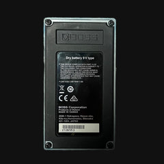 Back view of a BOSS device with label and branding on a black background