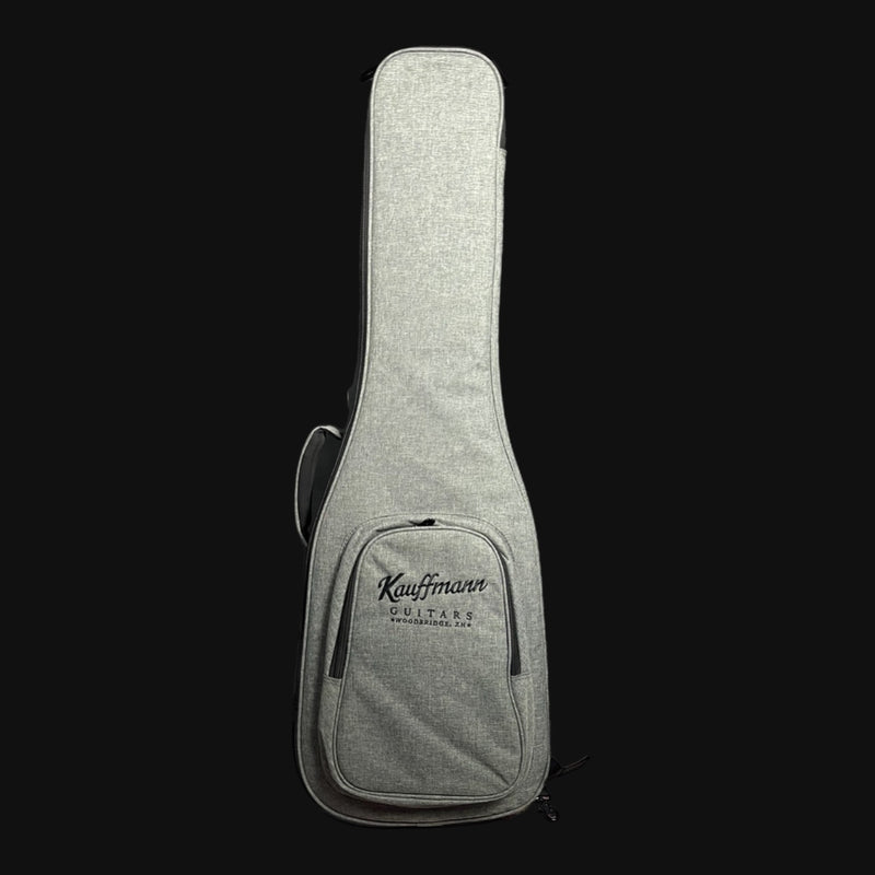 Gray guitar case with 'Kauffman Guitars' branding on a black background